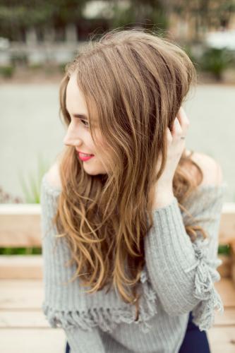 Young woman posing and smiling in the city - Australian Stock Image