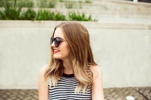 Young woman posing and smiling in the city - Australian Stock Image