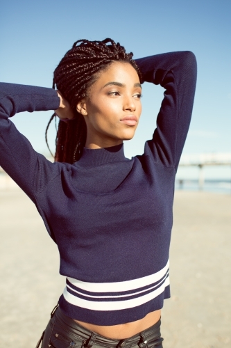 Young woman posing on a beach - Australian Stock Image