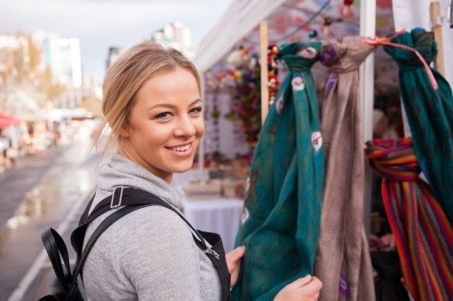 Young Woman Shopping at Outdoor Market