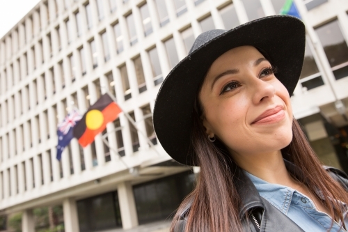 Young Woman Walking Past Parliament - Australian Stock Image