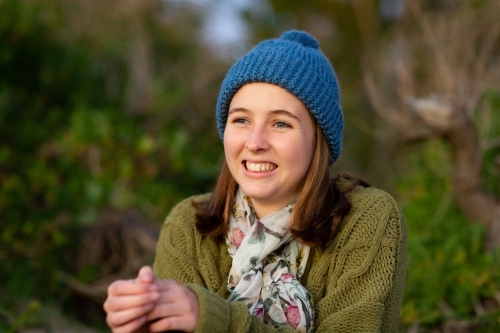 young woman wearing warm knitted beanie and sweater - Australian Stock Image