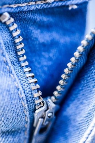 Zipper on denim clothing - Australian Stock Image