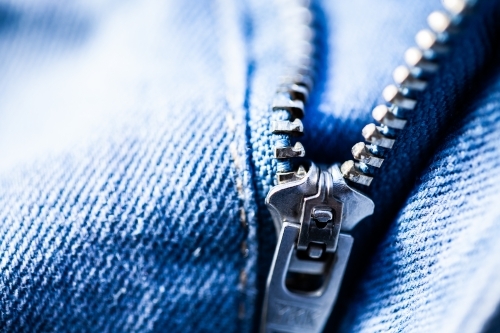 Zipper on denim clothing - Australian Stock Image